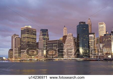 Stock Image - USA, New York State, New York City, cityscape in evening. Fotosearch