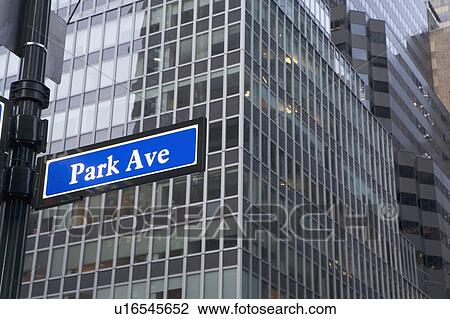 USA, New York State, New York City, street name sign in front of building exterior View Large Photo Image Stock Image - USA, New York State, New York City, street name sign in front of building exterior. Fotosearch