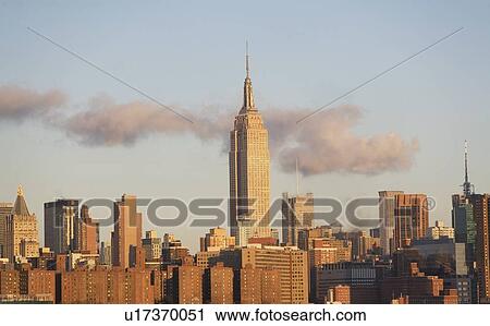 Stock Image - USA, New York State, New York City, cityscape with view at Empire State Building. Fotosearch