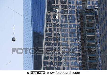 Stock Image - Usa, New York State, New York City, part of skyscraper with view on cargo. Fotosearch