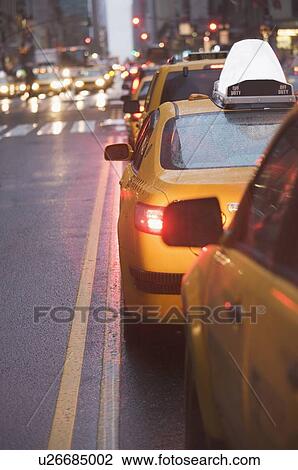 Stock Image - USA, New York state, New York city, taxi cars in traffic jam. Fotosearch