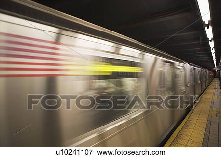 Stock Photo - USA, New York State, New York City, blurred motion of subway train. Fotosearch