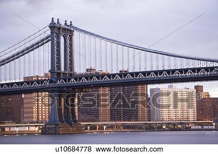 Stock Photo - USA, New York State, New York City, bridge with city in background. Fotosearch