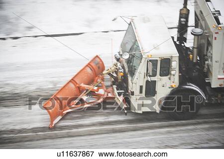 USA, New York State, New York City, high angle view of Snowplow plowing snow out of street View Large Photo Image Stock Photo - USA, New York State, New York City, high angle view of Snowplow plowing snow out of street. Fotosearch
