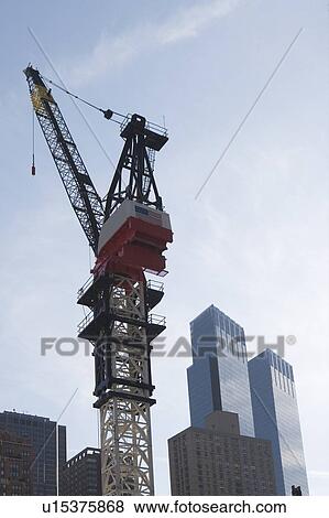 Usa, New York State, New York City, crane at construction site View Large Photo Image Stock Photo - Usa, New York State, New York City, crane at construction site. Fotosearch