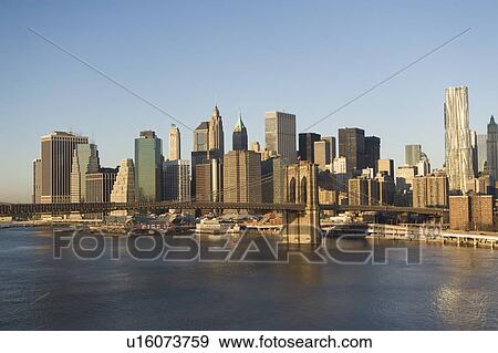 Stock Photo - USA, New York State, New York City, Brooklyn Bridge with skyscrapers. Fotosearch