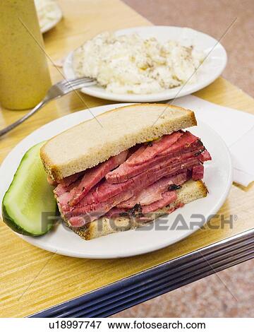 Stock Photo - USA, New York State, New York City, Pastrami sandwich. Fotosearch