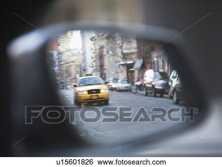 Stock Photograph - USA, New York state, New York city, close-up of taxi side-view mirror. Fotosearch