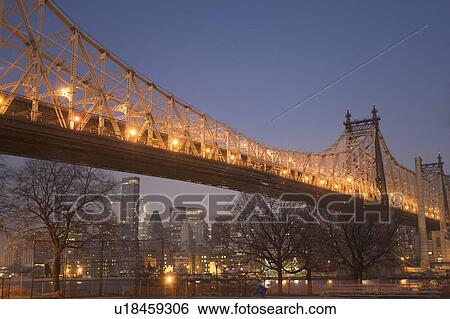 Stock Photograph - USA, New York State, New York City, illuminated queensboro bridge. Fotosearch