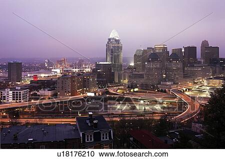 Stock Image - USA, Ohio, Cincinnati skyline at dawn. Fotosearch