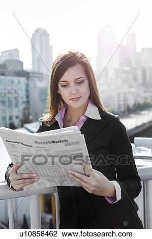 USA, Seattle, Young businesswoman reading newspaper View Large Photo Image Stock Image - USA, Seattle, Young businesswoman reading newspaper. Fotosearch