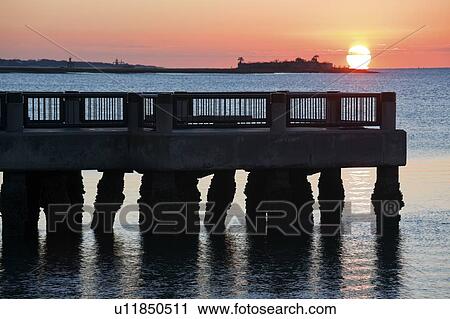 Stock Image - USA, South Carolina, Charleston, Castle Pinckney at sunrise. Fotosearch