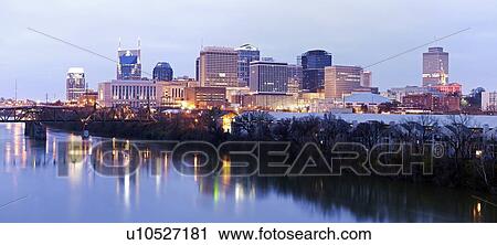 Stock Image - USA, Tennessee, Nashville, Panoramic cityscape at dawn. Fotosearch