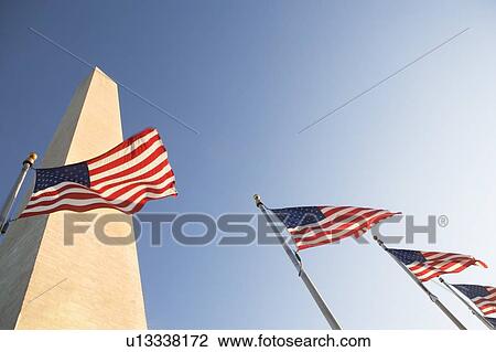 Stock Image - USA, Washington DC, low angle view on american flags. Fotosearch