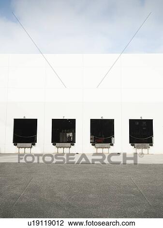 Warehouse with open loading docks View Large Photo Image Stock Image - Warehouse with open loading docks. Fotosearch