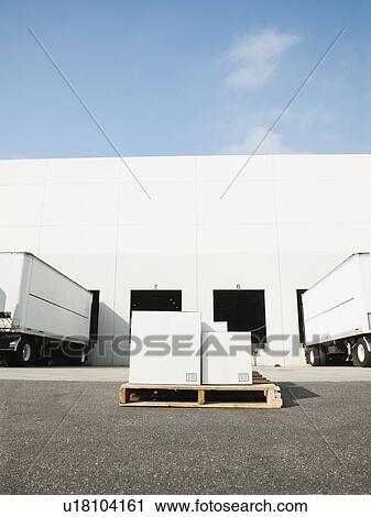 Warehouse with trucks and load View Large Photo Image Stock Image - Warehouse with trucks and load. Fotosearch