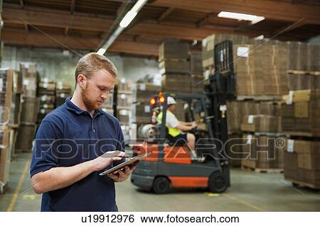 Stock Photograph - Warehouse worker. Fotosearch