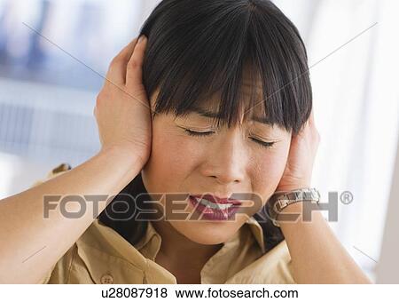 Woman covering ears View Large Photo Image Stock Photo - Woman covering ears. Fotosearch