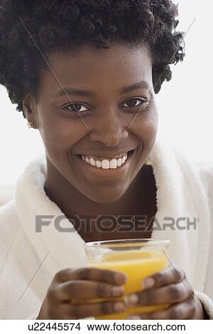 Picture - Woman drinking juice. Fotosearch