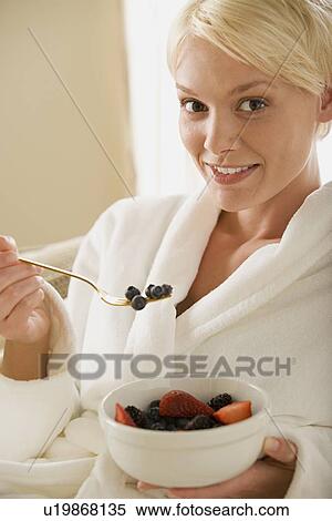 Woman eating fresh fruits View Large Photo Image Stock Photography - Woman eating fresh fruits. Fotosearch