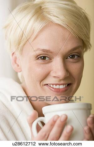 Woman enjoying cup of tea View Large Photo Image Stock Image - Woman enjoying cup of tea. Fotosearch
