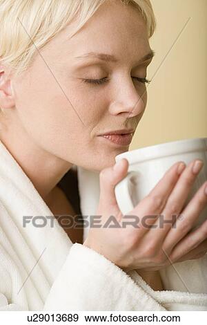 Stock Photo - Woman enjoying cup of tea. Fotosearch
