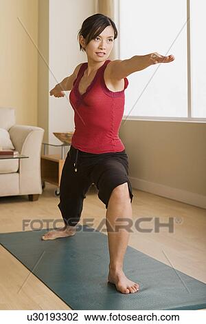 Stock Image - Woman in yoga pose. Fotosearch