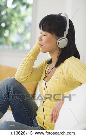 Woman listening music View Large Photo Image Stock Image - Woman listening music. Fotosearch