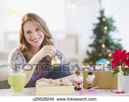 Woman preparing christmas decoration View Large Photo Image Stock Photography - Woman preparing christmas decoration . Fotosearch