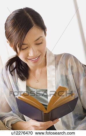 Woman reading book View Large Photo Image Stock Image - Woman reading book. Fotosearch