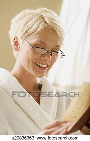 Stock Image - Woman reading book. Fotosearch