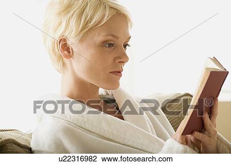 Stock Image - Woman reading book. Fotosearch