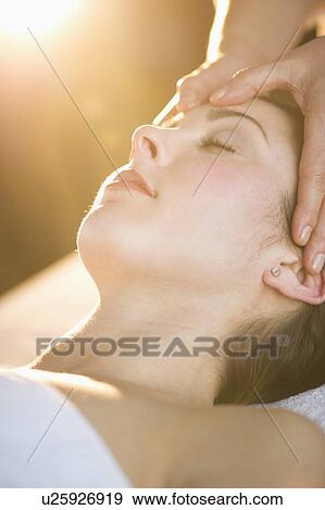 Woman receiving face massage View Large Photo Image Stock Photo - Woman receiving face massage. Fotosearch