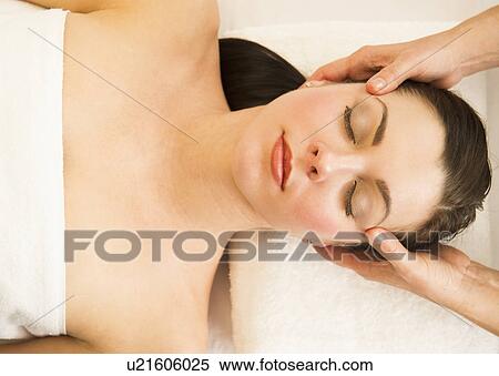 Woman receiving face massage View Large Photo Image Stock Photography - Woman receiving face massage. Fotosearch