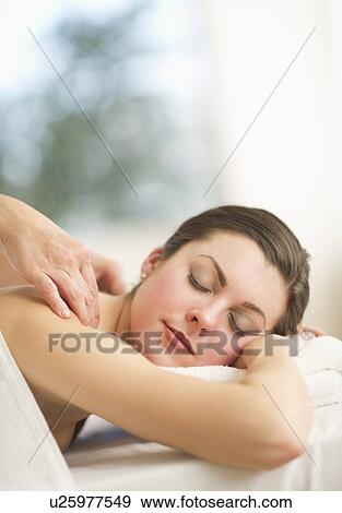 Woman receiving massage View Large Photo Image Stock Photo - Woman receiving massage. Fotosearch