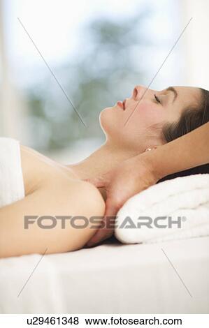 Woman receiving massage View Large Photo Image Stock Photo - Woman receiving massage. Fotosearch