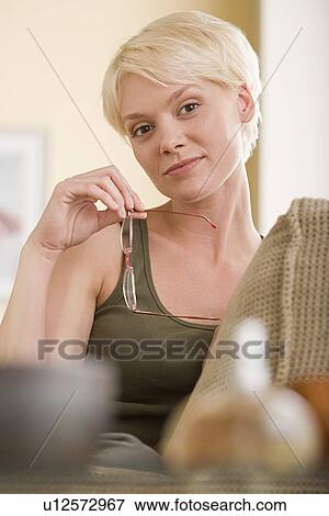 Stock Photo - Woman relaxing at home. Fotosearch