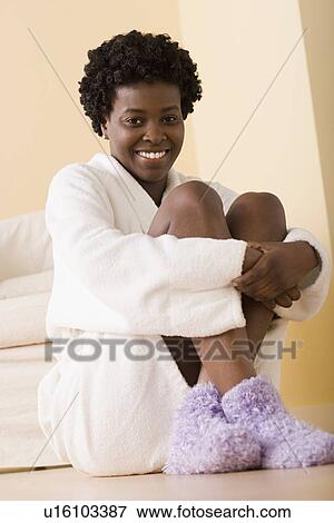 Woman sitting on floor View Large Photo Image Stock Photo - Woman sitting on floor. Fotosearch