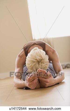 Picture - Woman stretching. Fotosearch