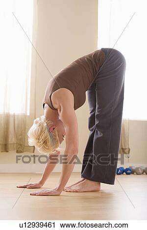 Woman stretching View Large Photo Image Stock Image - Woman stretching. Fotosearch
