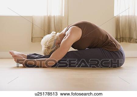 Woman stretching View Large Photo Image Stock Image - Woman stretching. Fotosearch