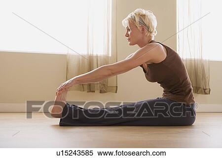Woman stretching View Large Photo Image Stock Photography - Woman stretching. Fotosearch