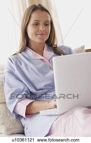 Stock Image - Woman using laptop. Fotosearch
