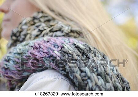 Woman wearing knit scarf View Large Photo Image Stock Photo - Woman wearing knit scarf. Fotosearch