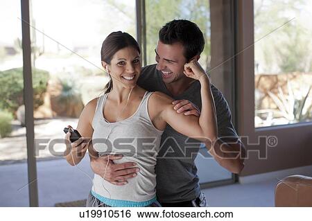 Woman with coach flexing muscle View Large Photo Image Stock Photograph - Woman with coach flexing muscle. Fotosearch
