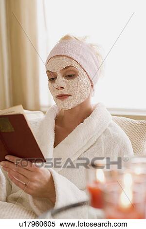 Woman with facial mask reading book View Large Photo Image Stock Photography - Woman with facial mask reading book. Fotosearch