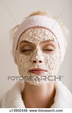 Stock Photo - Woman with facial mask. Fotosearch