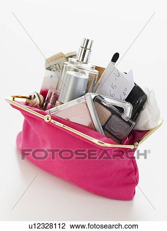 Stock Image - Woman's purse overflowing. Fotosearch