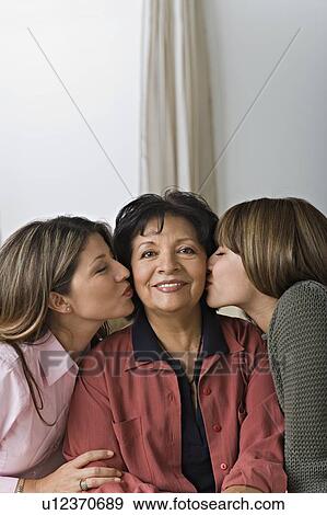 Stock Photo - Women in three generation family. Fotosearch