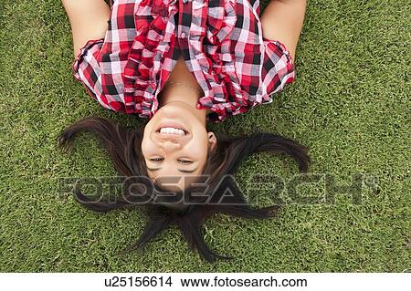 Young smiling woman looking at camera View Large Photo Image Picture - Young smiling woman looking at camera. Fotosearch